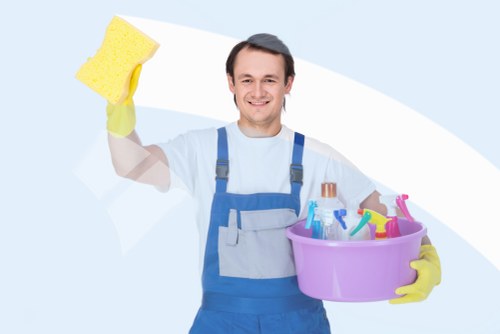 Carpet cleaning staff using protective gloves and footwear during work