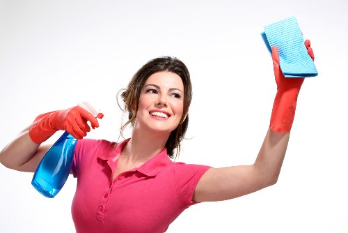 Close-up of upholstery cleaning equipment on a fabric chair
